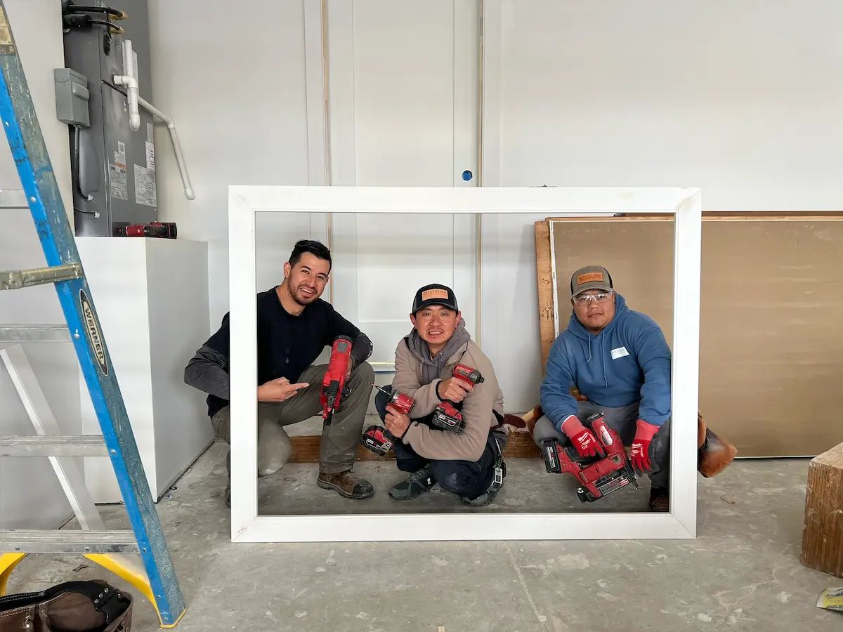 Three members of Alpine Haus Construction team posing together for photo